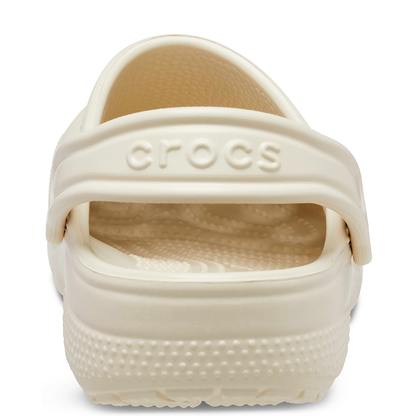 Heel view of Crocs classic clogs in bone colour with logo showing on heel strap