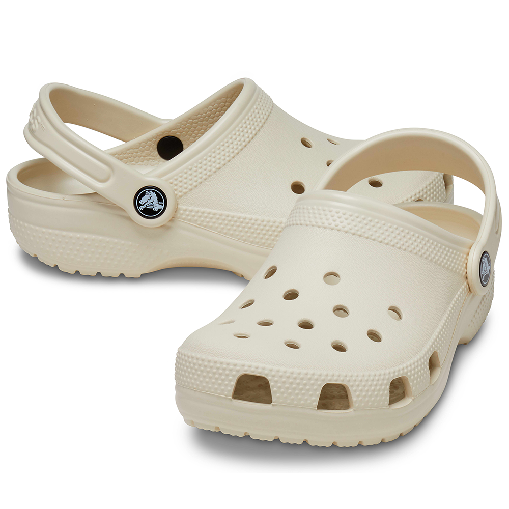 Pair of Crocs clogs classic style with holes in bone colours, for men and women.